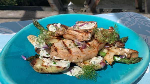 BBQ pork rack chops with grilled potatoes and asparagus, yoghurt dressing.