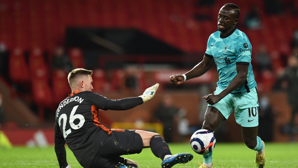 Sadio Mane in action against Manchester United goalkeeper Dean Henderson at Old Trafford
