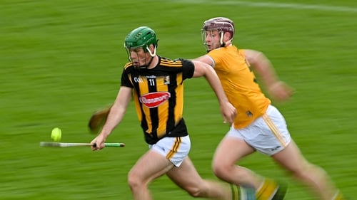 Eoin Cody of Kilkenny races clear of Eoghan Campbell of Antrim
