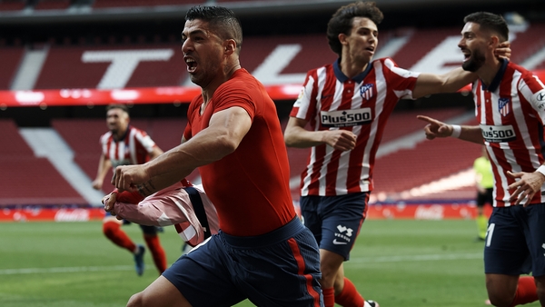 Luis Suarez celebrates the winning goal that leaves Atletico one win away from securing the title