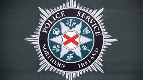 The PSNI said metal garden furniture was thrown at the officers