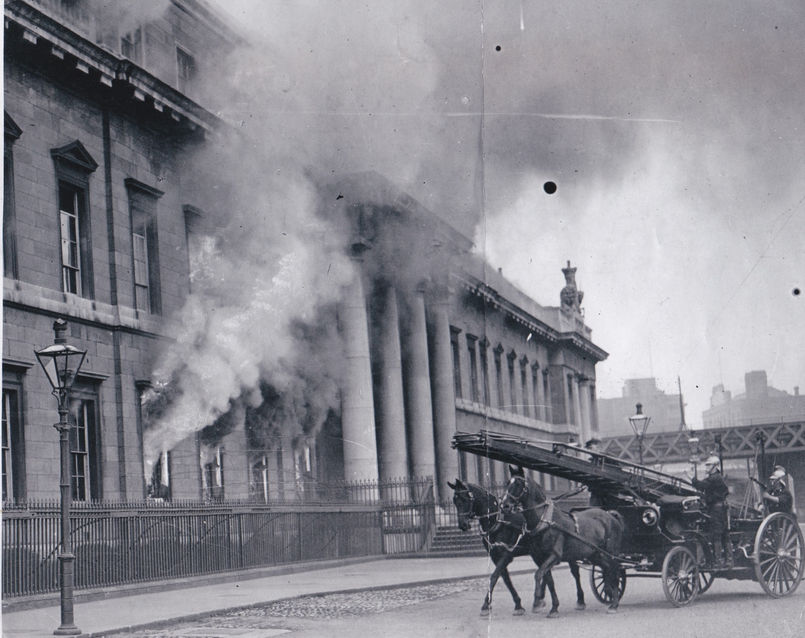 Image - The first units of the Dublin Fire Brigade arriving as the blaze takes hold of the building. Credit: Michael Ward.