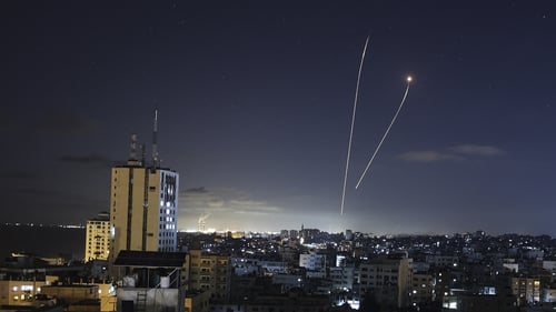 A streak of light appears as Israel's Iron Dome anti-missile system intercepts rockets launched from Gaza