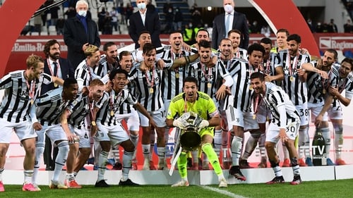 Juventus' goalkeeper Gianluigi Buffon lifts the cup