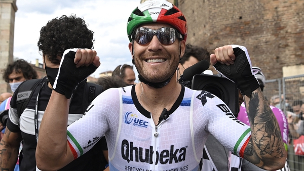 Giacomo Nizzolo celebrates after winning the 13th stage