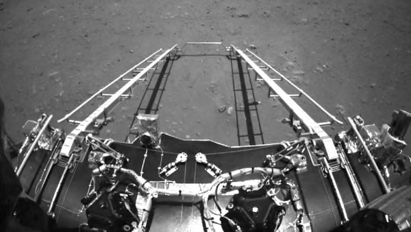 An image taken by Zhurong's front obstacle avoidance camera, showing the deployment of the ramp mechanism after on Mars