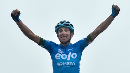 Lorenzo Fortunato celebrates as he crosses the finish line to win the 14th stage