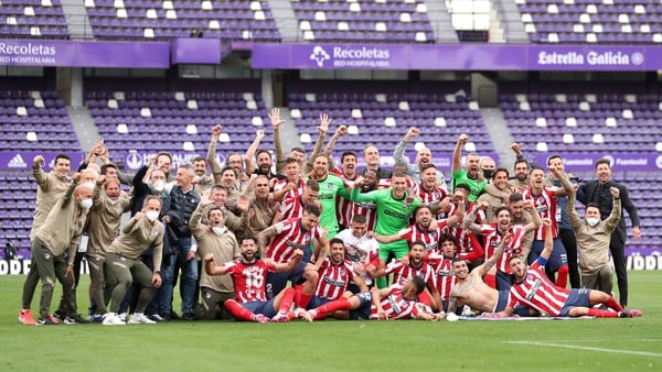 Atletico Madrid players celebrate winning the league title on the final day