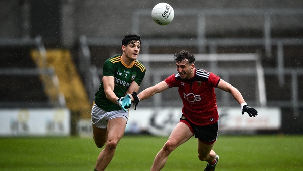Meath's Seamus Lavin gets a pass away despite the close attention of Down's Barry O'Hagan