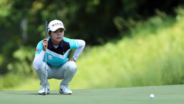 Wei-Ling Hsu of Chinese Taipei lines up her putt on the eighth hole during the final round