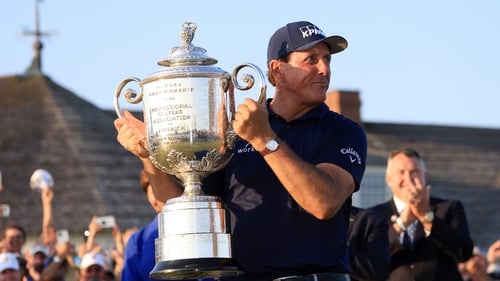 Phil Mickelson celebrates with the Wanamaker Trophy