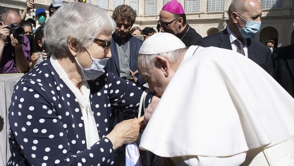 Pope Francis kisses the tattoo on Lidia Maksymowicz's arm