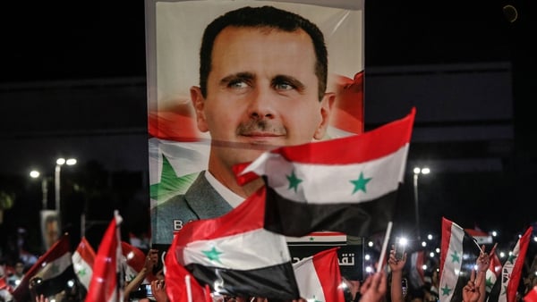 Bashar al-Assad's supporters celebrate his victory in ths year's presidential election