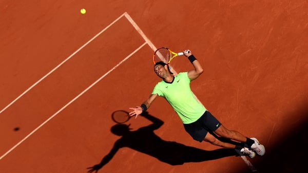 Rafael Nadal serves against Alexei Popyrin