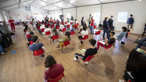 Italians attend a vaccination centre in Rome to receive the Covid-19 jab