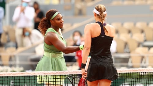 Elena Rybakina of Kazakhstan (R) shakes hands with Serena Williams after the game