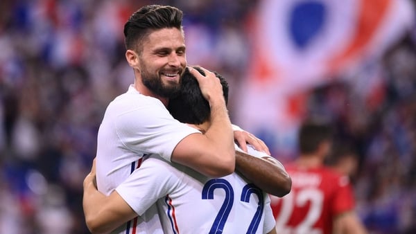 Olivier Giroud (L) rose off the bench to score twice