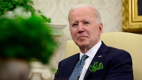Joe Biden listens during a virtual meeting with Taoiseach Micheál Martin in the Oval Office of the White House on St Patrick's Day