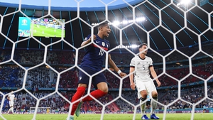 Kylian Mbappe of France celebrates their side's first goal, an own goal by Mats Hummels