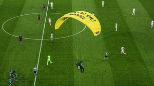 Debris fell on the pitch when parachutist got tangled in wires of overhead camera