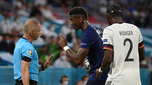 Pogba speaks with assistant referee, Juan Carlos Yuste after the incident