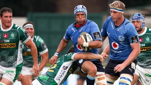 Gio Aplon is tackled by Benetton's Marco Zanon