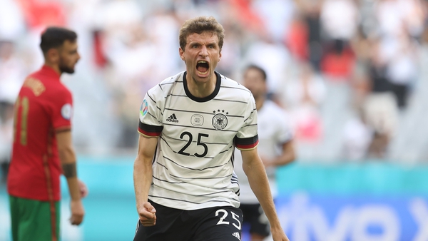 Thomas Müller celebrates Germany's third goal against Portugal