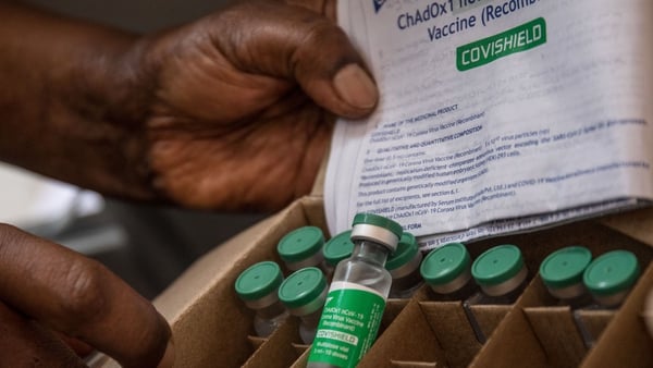 A staff member of Uganda's ministry of health holds a box of Oxford AstraZeneca Covid-19 vaccines (File image)