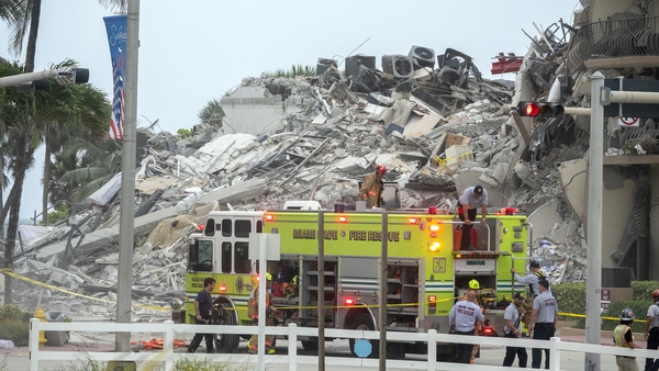 Rescue teams search in the rubble of the partially collapsed 12-storey condominium building in Surfside, Florida