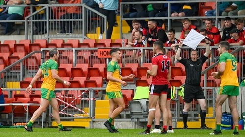 Michael Murphy leaves the field of play in the first half at Páirc Esler Park