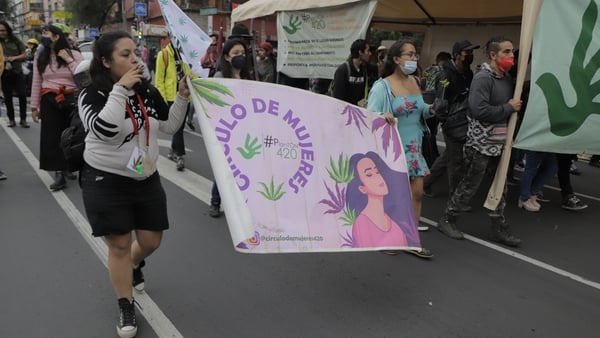 Legalise cannabis supporters marching outside Mexico's supreme court