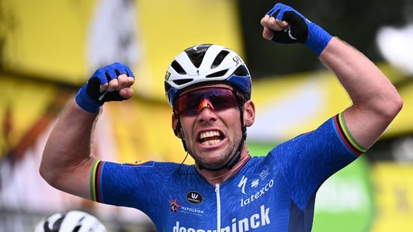 Cavendish celebrates as he crosses the finish line of the fourth stage