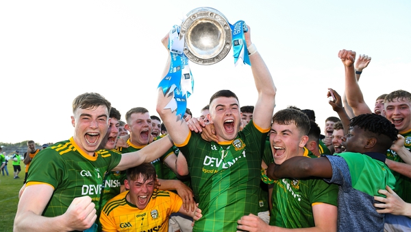 Meath captain Eoghan Frayne lifts the cup as his team-mates celebrate