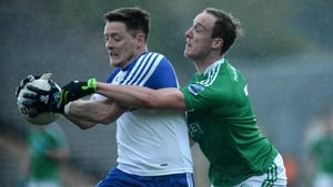 Monaghan's Conor McManus attempts to escape the clutches of Che Cullen of Fermanagh