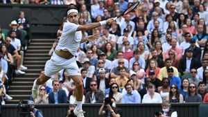 Roger Federer fires a forehand in his win over Cameron Norrie