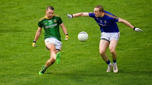 Joey Wallace of Meath in action against Patrick Fox of Longford