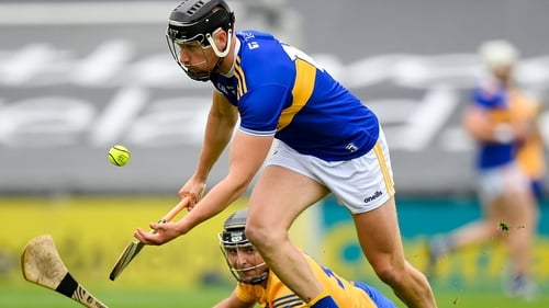 Tipperary forward Dan McCormack beats Cathal Malone to possession