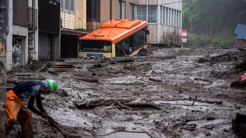 Mud and debris piled high following days of heavy rain in Atami, Japan