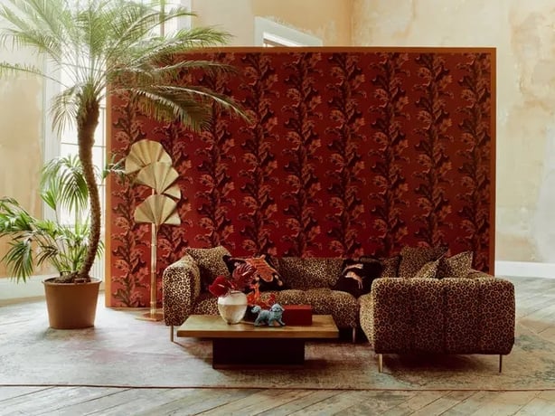 Paloma Home Oriental Leaves Wallpaper, £35 per roll; Paloma Home Rock N'Roll Leopard Print Sofa, from £4,399, Sofology (Michael Sinclair/Olivia Gregory/PA)