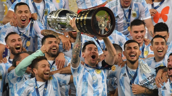 Lionel Messi lifts the Copa America trophy as he celebrates with his Argentina teammates