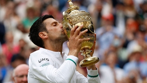 Novak Djokovic kisses the winner's trophy