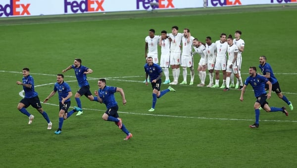The Italian team react after Gianluigi Donnarumma's save seals the Euro 2020 title for them against England last night.