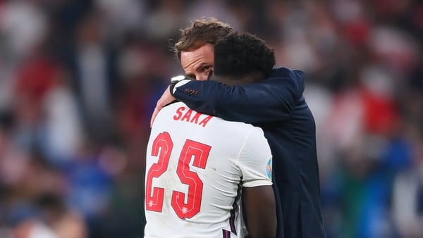 Bukayo Saka is consoled by England manager Gareth Southgate after missing the final penalty