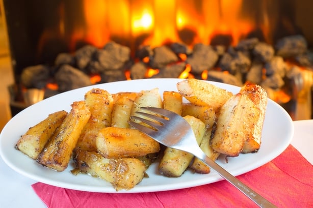 A dish of roast parsnips at Christmas (Alamy/PA)