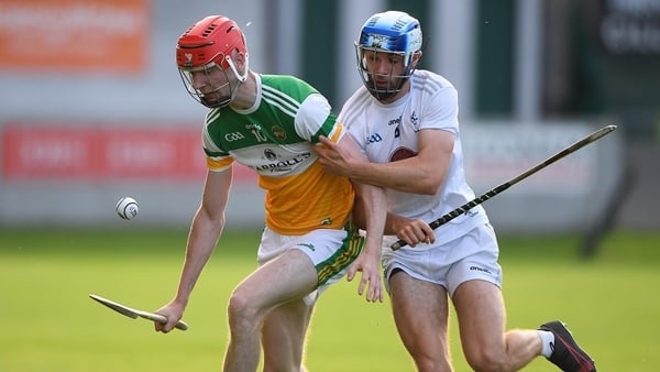 Tom Dooley and Cian Shanahan contest possession