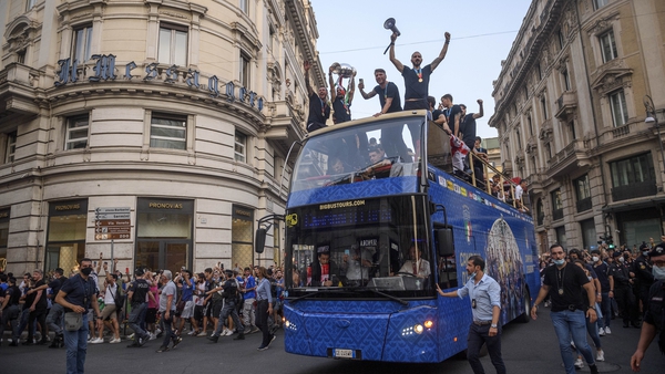 Thousands of euphoric fans thronged the centre of Rome on Monday afternoon to hail coach Roberto Mancini and his team after their triumph over England on penalties