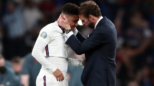 England manager Gareth Southgate consoles Jadon Sancho (L) following England's penalty shoot-out defeat in the Euro 2020 final