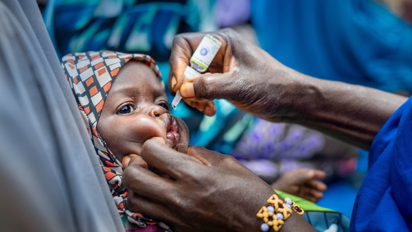 A child receives a polio vaccine in Nigeria