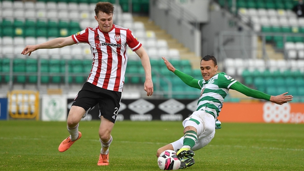 Graham Burke challenges Cameron McJannet during Shamrock Rovers' clash with Derry in May