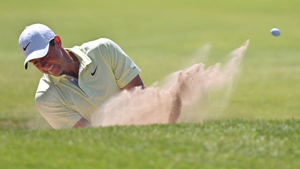 Rory McIlroy chips on to the seventh green at Royal St George's from the bunker